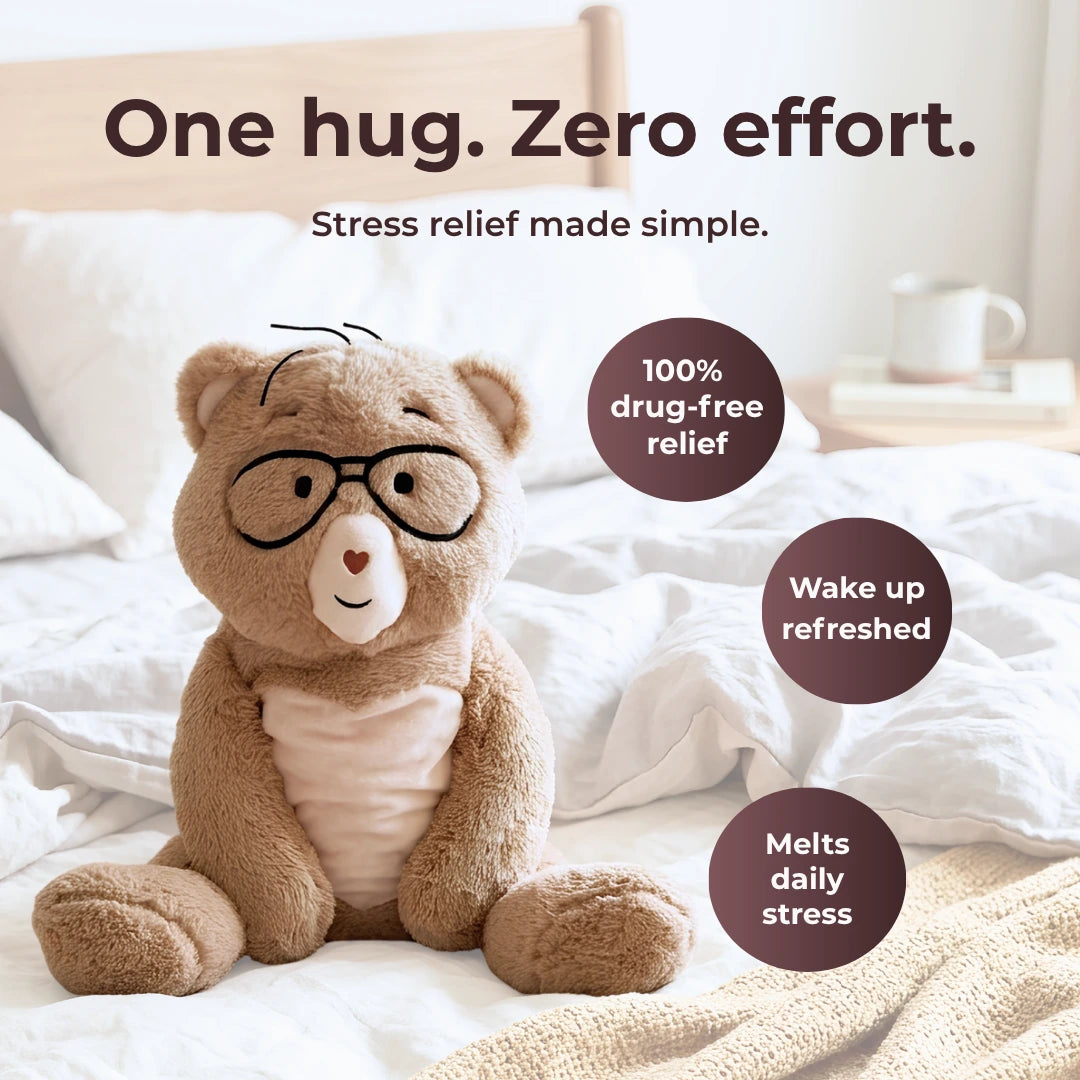 Percy the 5 lb. comfort bear sitting on a bed with a yellow blanket and text saying "One hug. Zero effort."